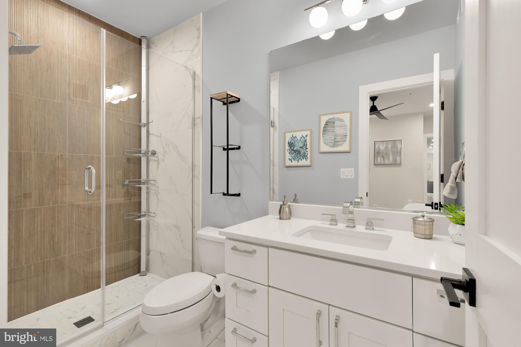 2829 13th Street Northwest, Unit 1 Washington, DC 20009 - Photo 17 of 23 a bathroom with a sink a toilet and shower