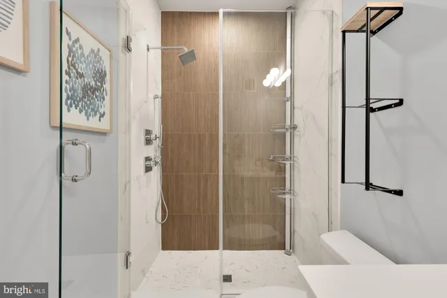 a bathroom with a shower and a sink