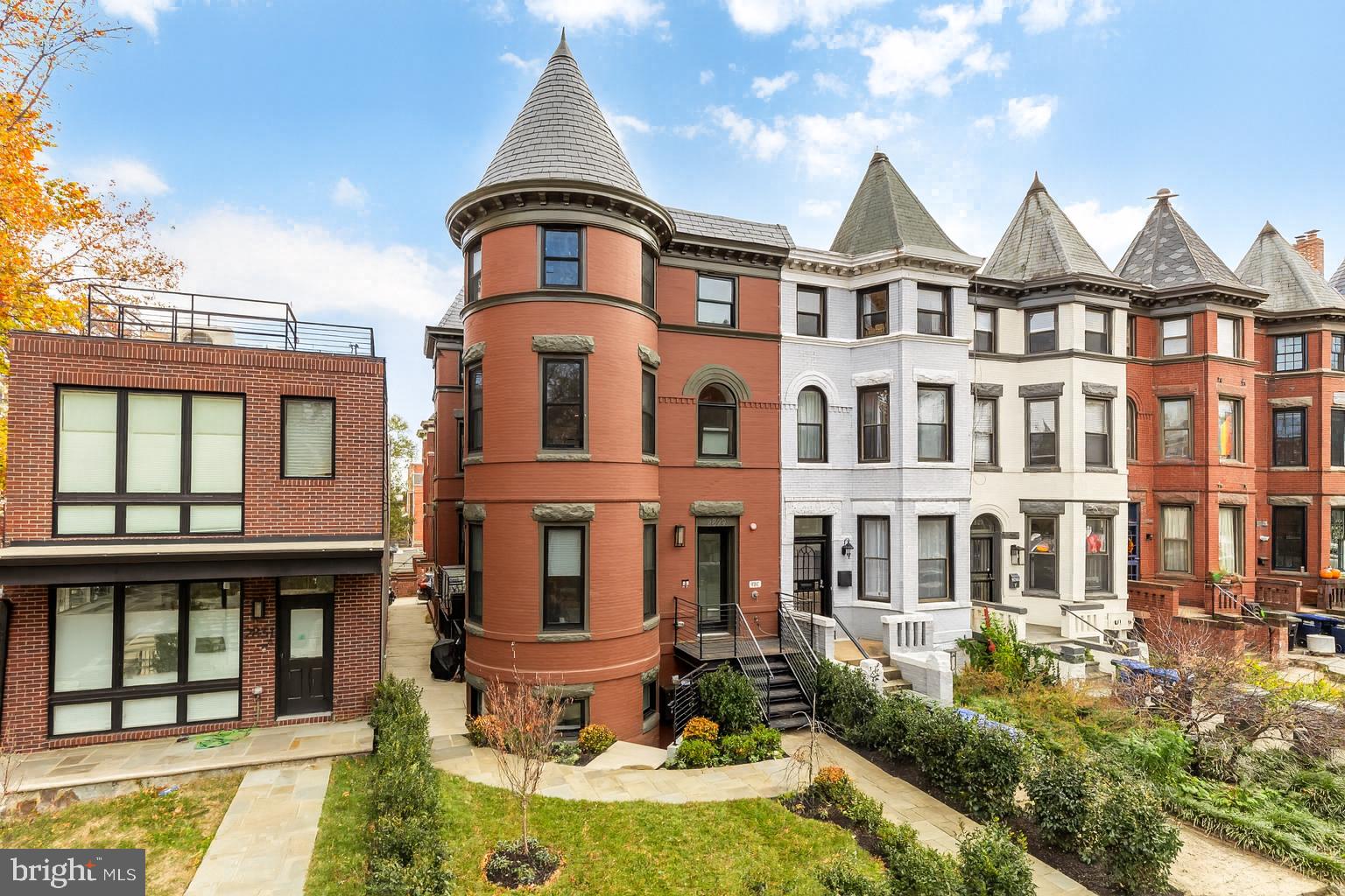 2829 13th Street Northwest, Unit 1 Washington, DC 20009 - Photo 2 of 23 a front view of a residential apartment building with a yard
