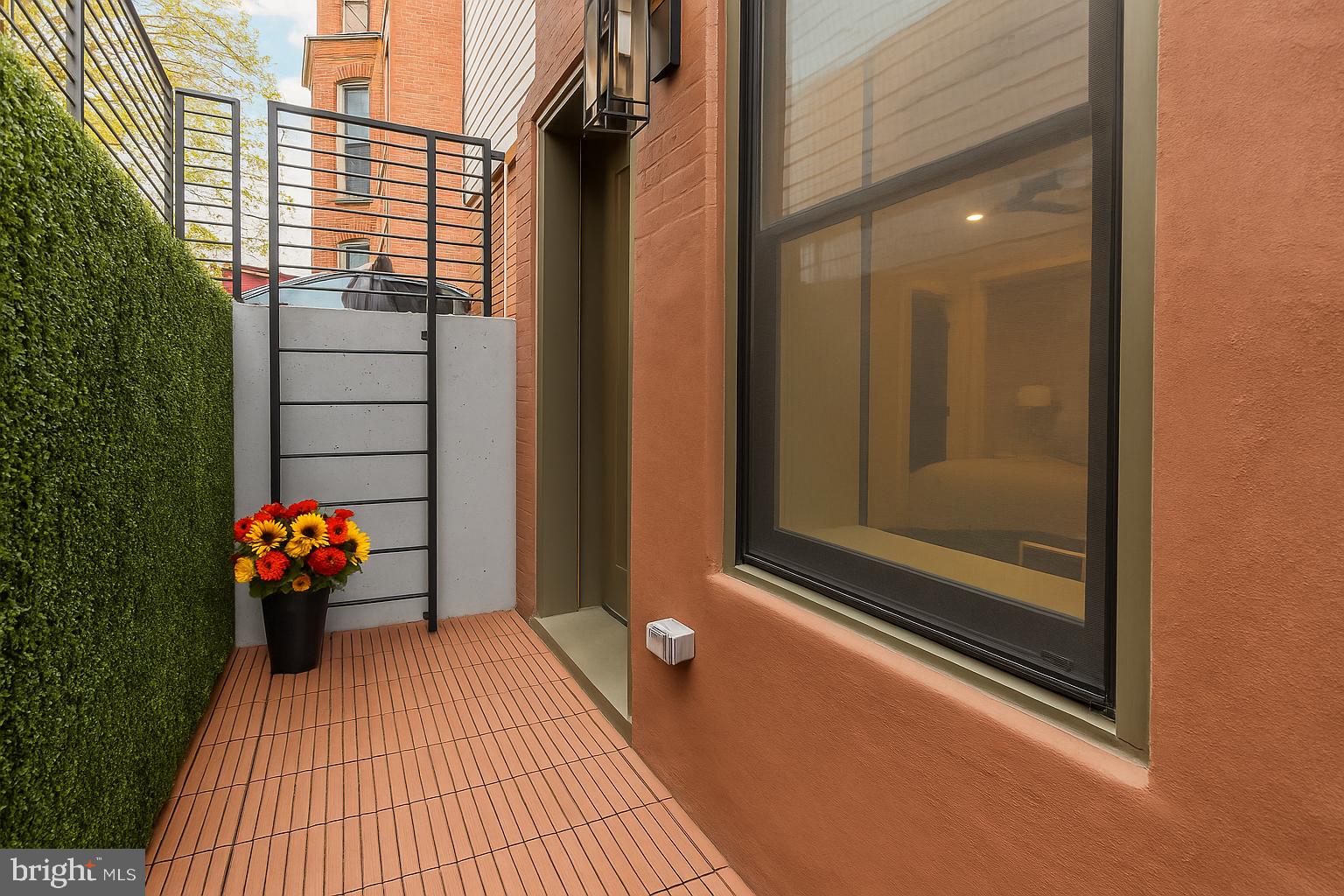2829 13th Street Northwest, Unit 1 Washington, DC 20009 - Photo 22 of 23 a balcony with couch on the wall