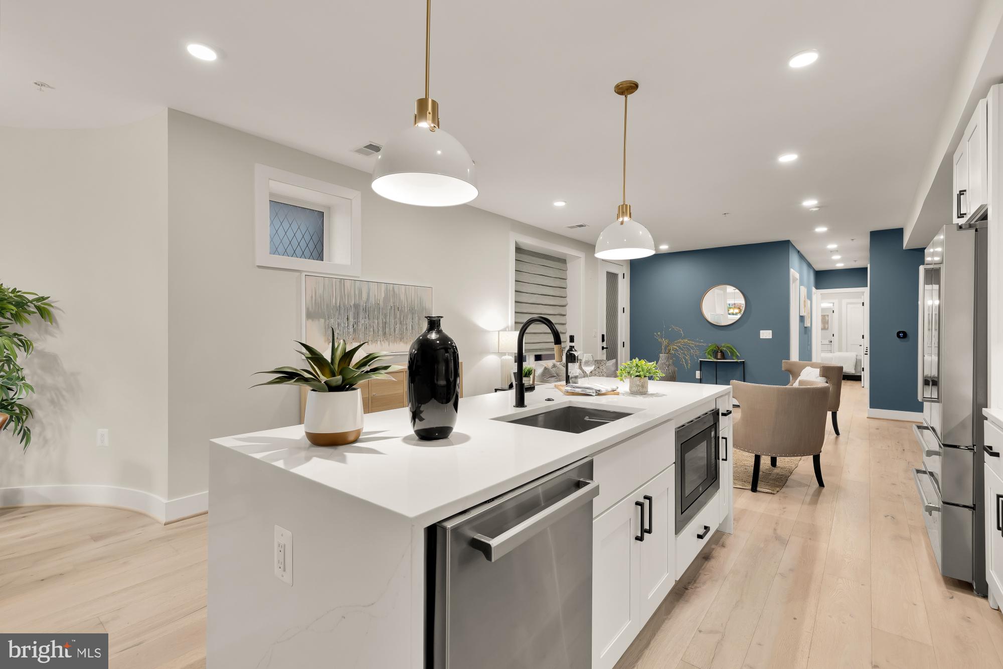 2829 13th Street Northwest, Unit 1 Washington, DC 20009 - Photo 8 of 23 a kitchen with stainless steel appliances granite countertop a sink a stove top oven a counter space and cabinets