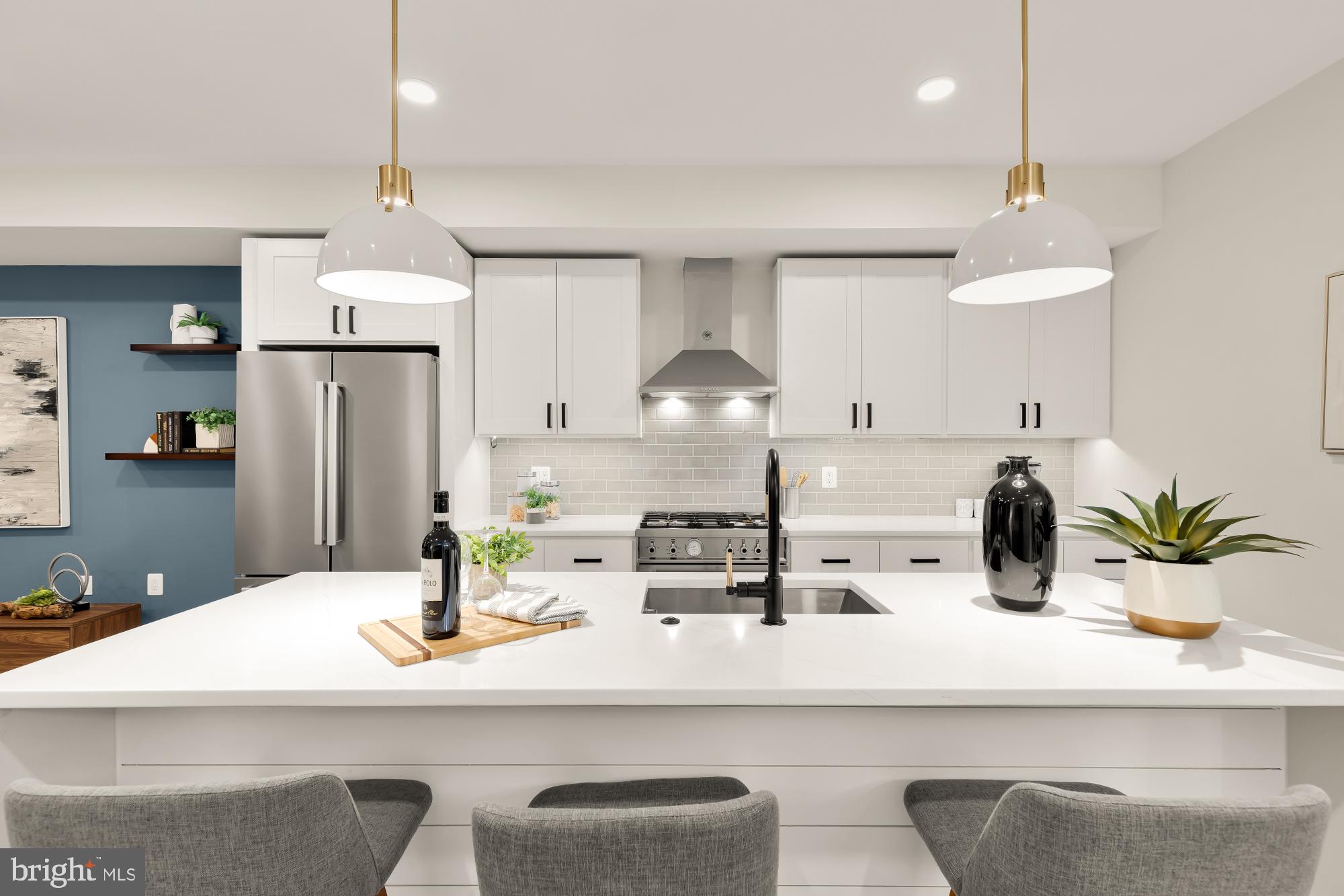 2829 13th Street Northwest, Unit 1 Washington, DC 20009 - Photo 10 of 23 a kitchen with a sink a refrigerator and chairs
