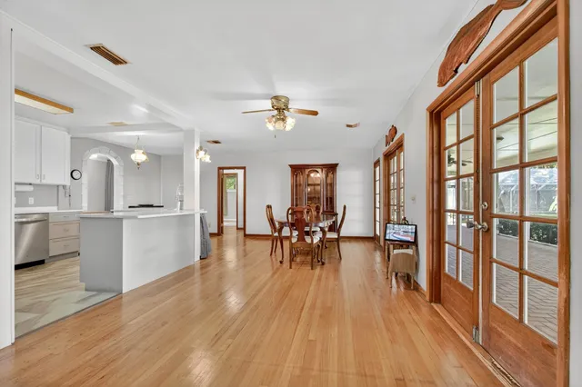 a kitchen with cabinets stainless steel appliances and window