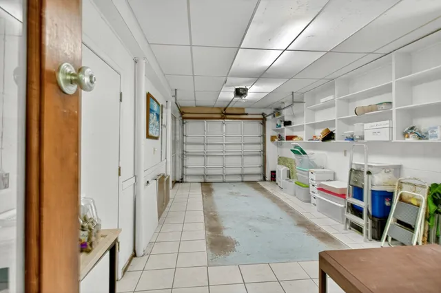 a kitchen with a refrigerator and cabinets