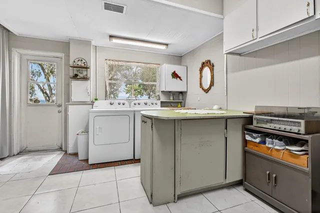 a bathroom with a sink a mirror and shower