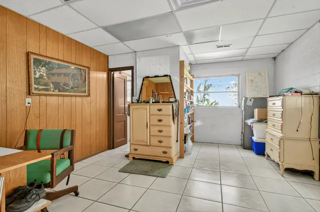 a view of a entryway with furniture and a kitchen