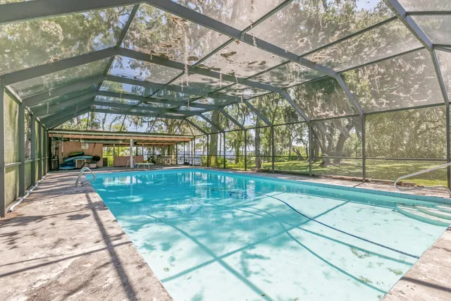 a view of a swimming pool with a porch