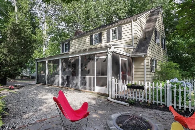 a house view with a sitting space and garden