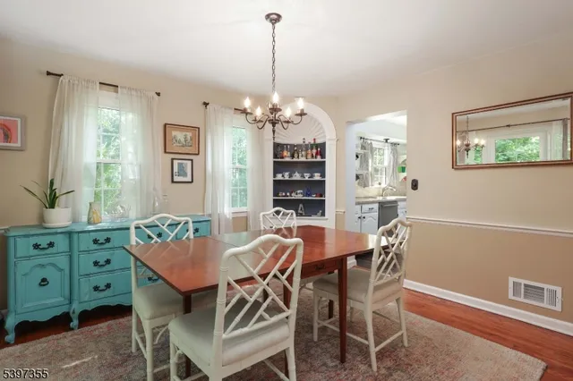 a view of a dining room with furniture and window