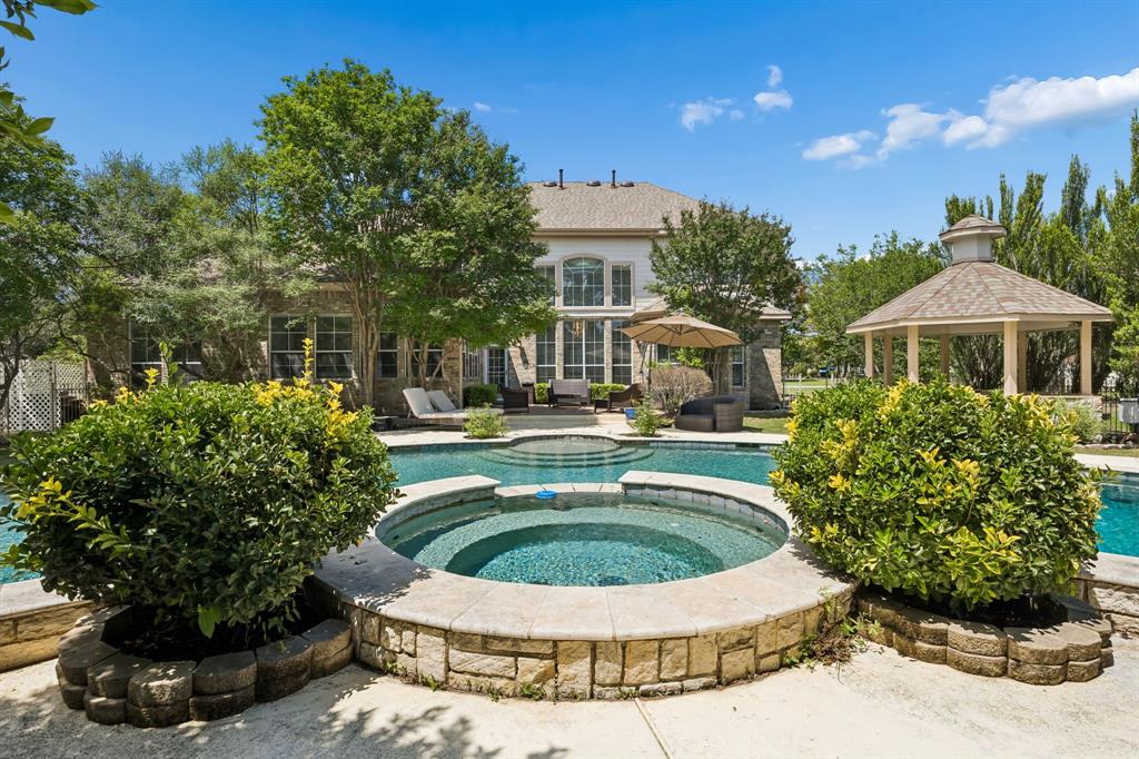 5808 Rathbone Drive Parker, TX 75002 - Photo 3 of 39 Beautiful view of the sparkling pool and spa looking toward the back of the home.