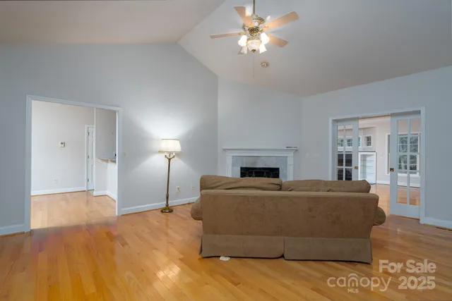 a bed room with a bed and a chandelier