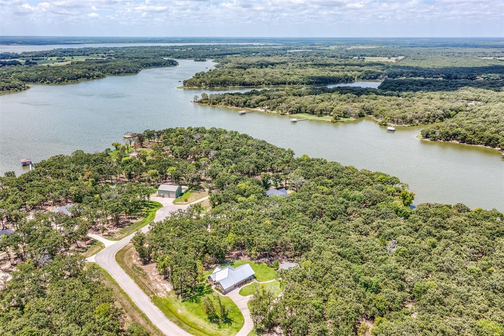 Lot 68 Anchor Point Quinlan, TX 75474 - Photo 16 of 16 Drone / aerial view of a nearby body of water and a forest