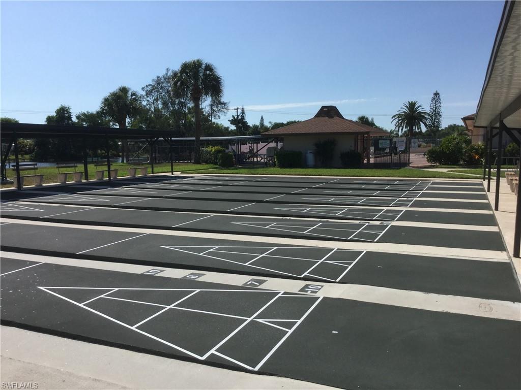 124 Versailles Circle Naples, FL 34112 - Photo 18 of 19 a view of a tennis court