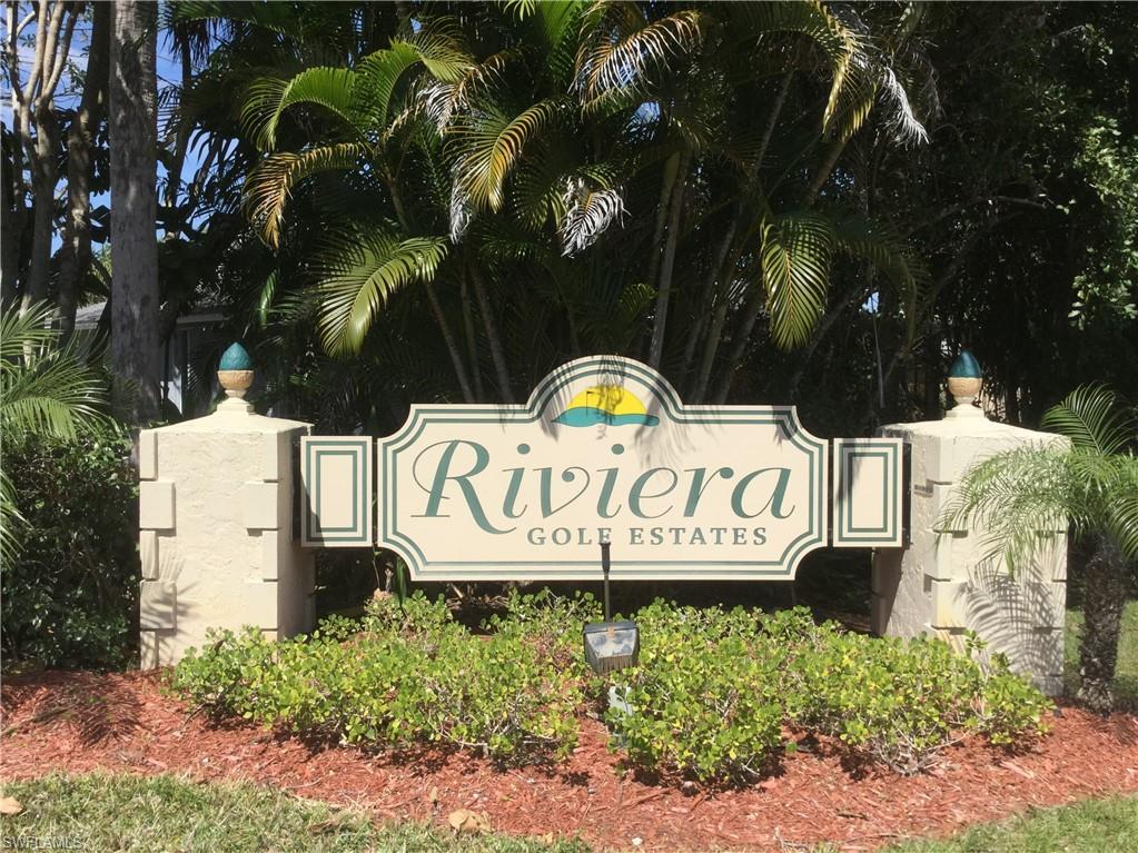 124 Versailles Circle Naples, FL 34112 - Photo 19 of 19 a sign that is on a blue wall