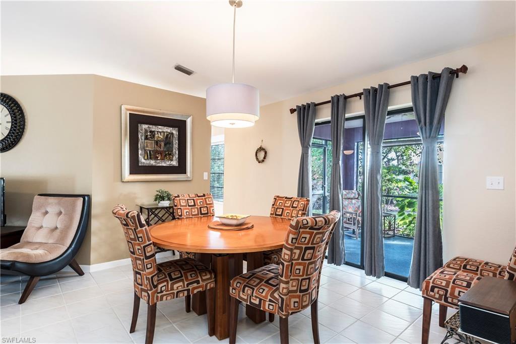 124 Versailles Circle Naples, FL 34112 - Photo 5 of 19 a view of a dining room with furniture window and outside view
