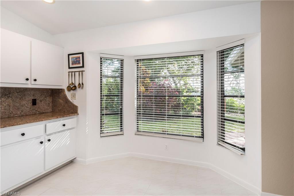 124 Versailles Circle Naples, FL 34112 - Photo 6 of 19 a bathroom with a tub and a window