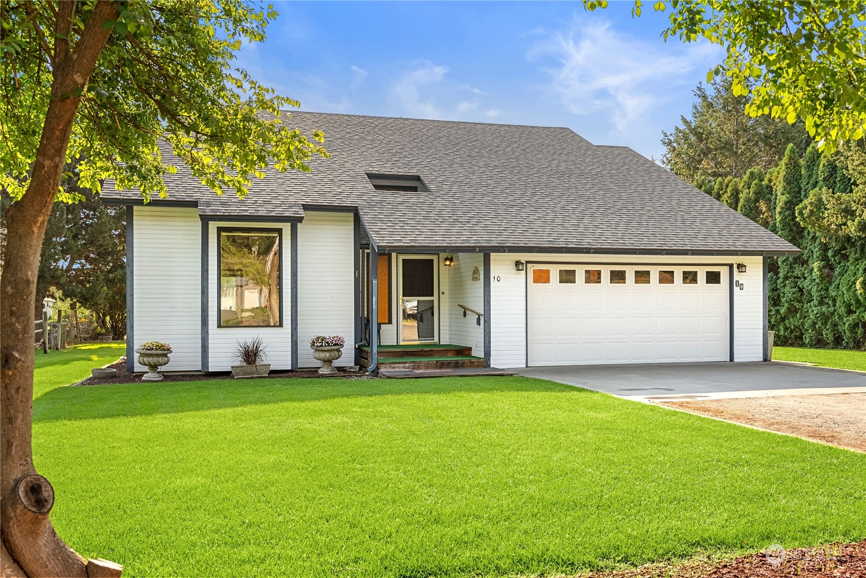 10 Pogue Road Okanogan, WA 98840 - Photo 1 of 40 a view of a house with a yard and large tree