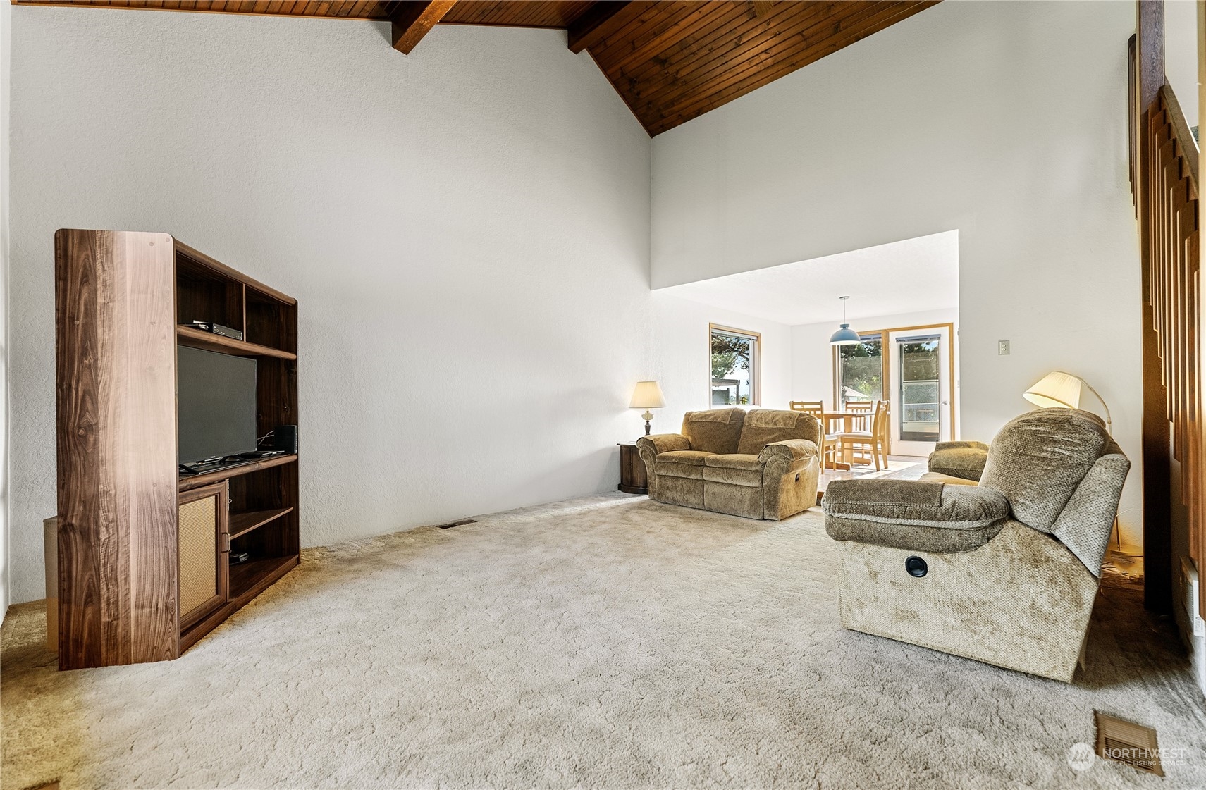 10 Pogue Road Okanogan, WA 98840 - Photo 9 of 40 a living room with furniture gym equipment and a refrigerator