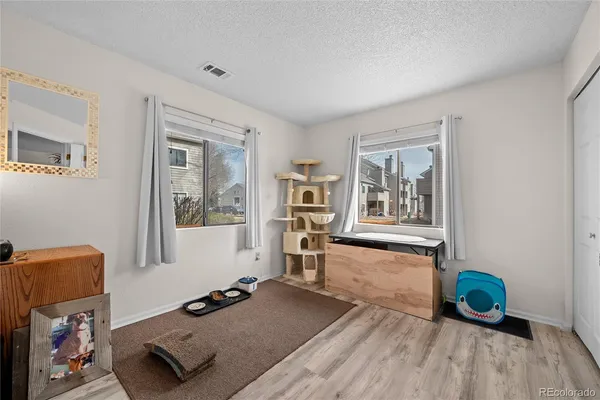 a living room with hard wood floors and a window
