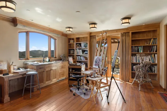 a room with lots of wooden furniture and a wooden floor