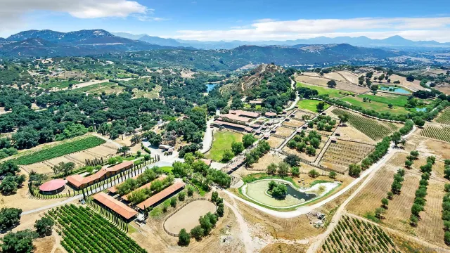 a view of a city with mountains in the background