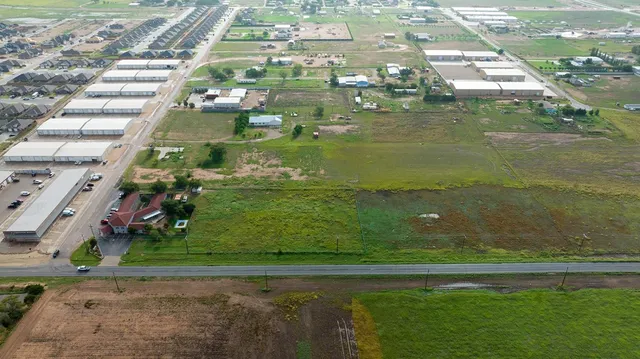 an aerial view of a pool yard patio and outdoor seating