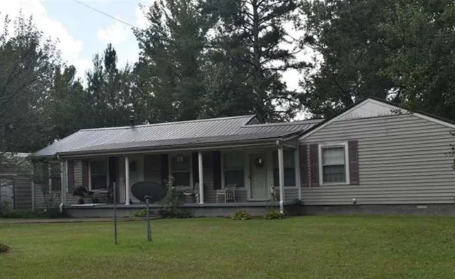 a view of a house with a garden
