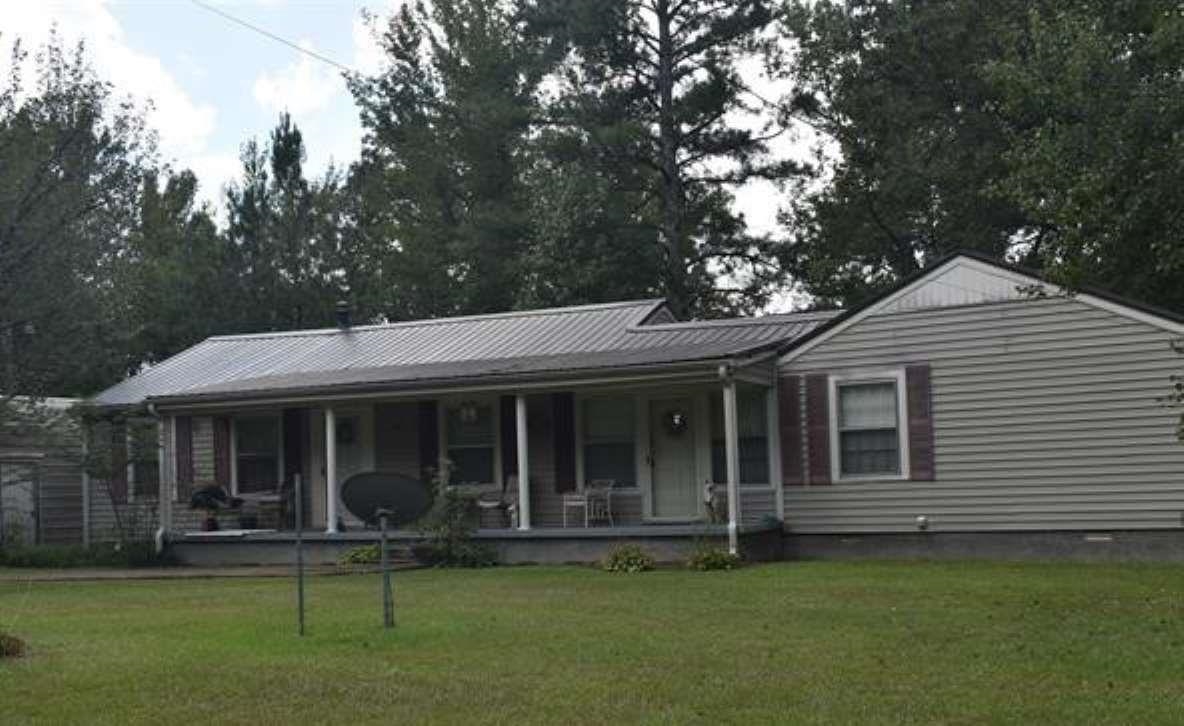 115 Falcon Street Selmer, TN 38375 - Photo 2 of 29 a view of a house with a garden
