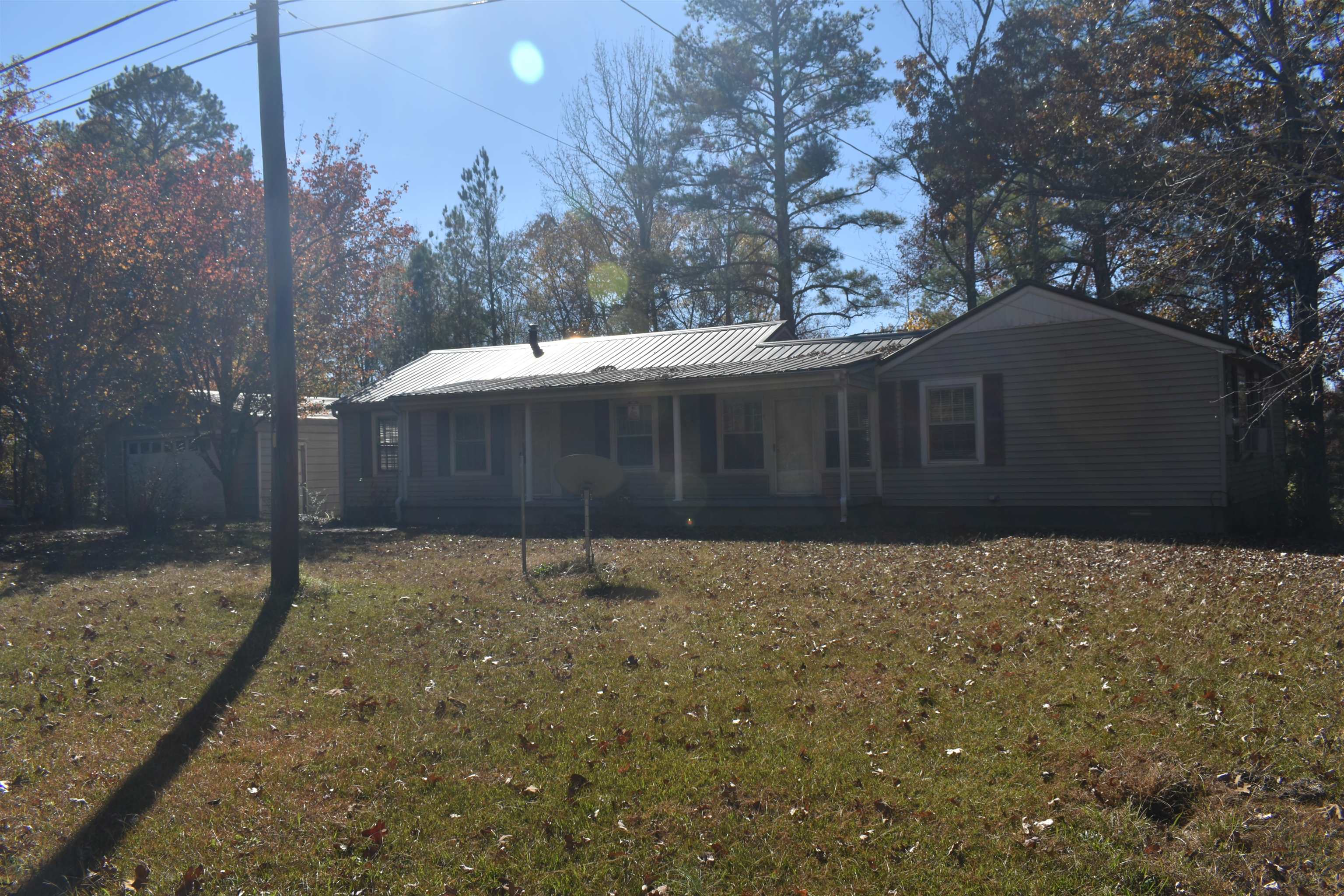 115 Falcon Street Selmer, TN 38375 - Photo 4 of 29 a backyard of a house