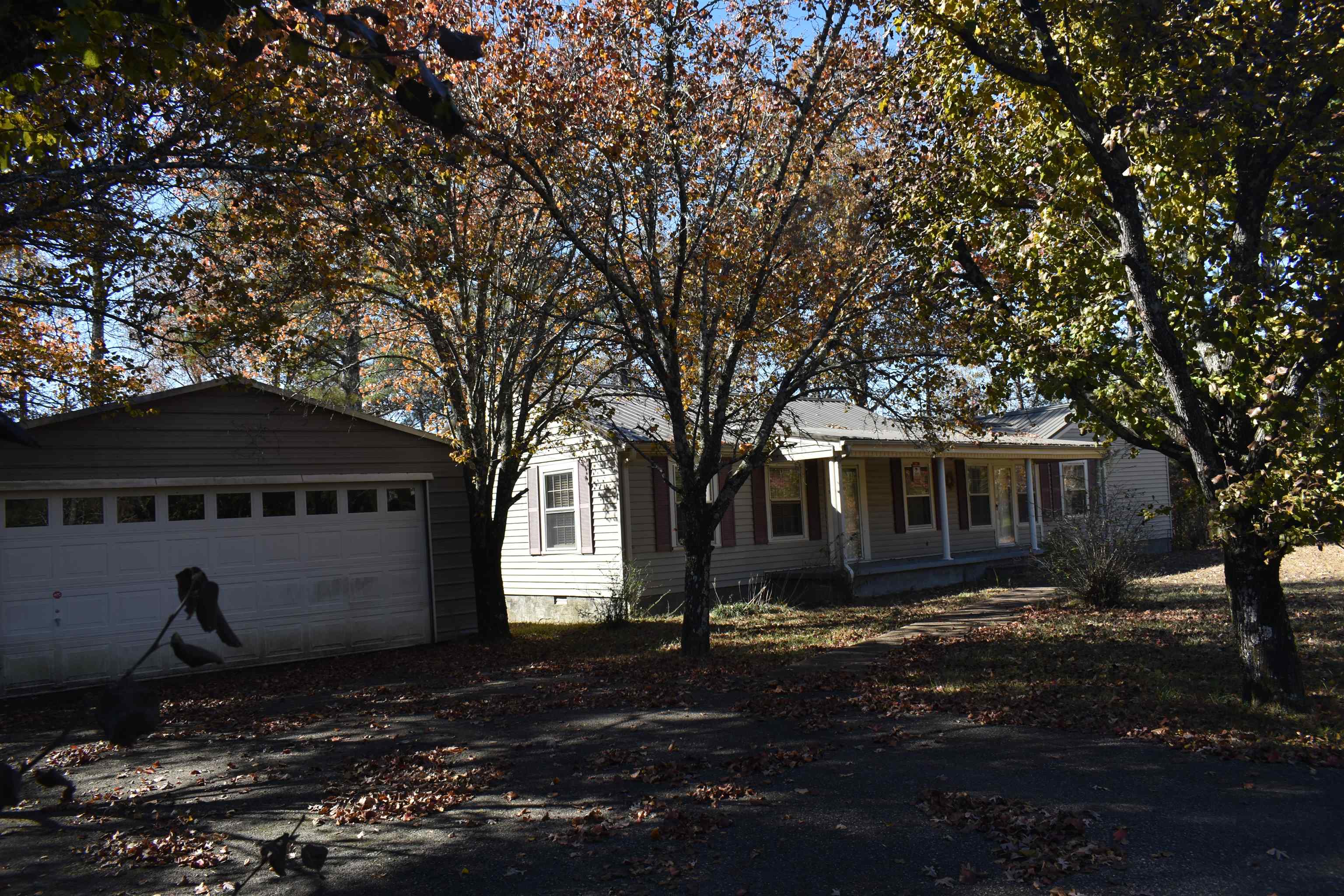 115 Falcon Street Selmer, TN 38375 - Photo 5 of 29 a front view of a house with a yard