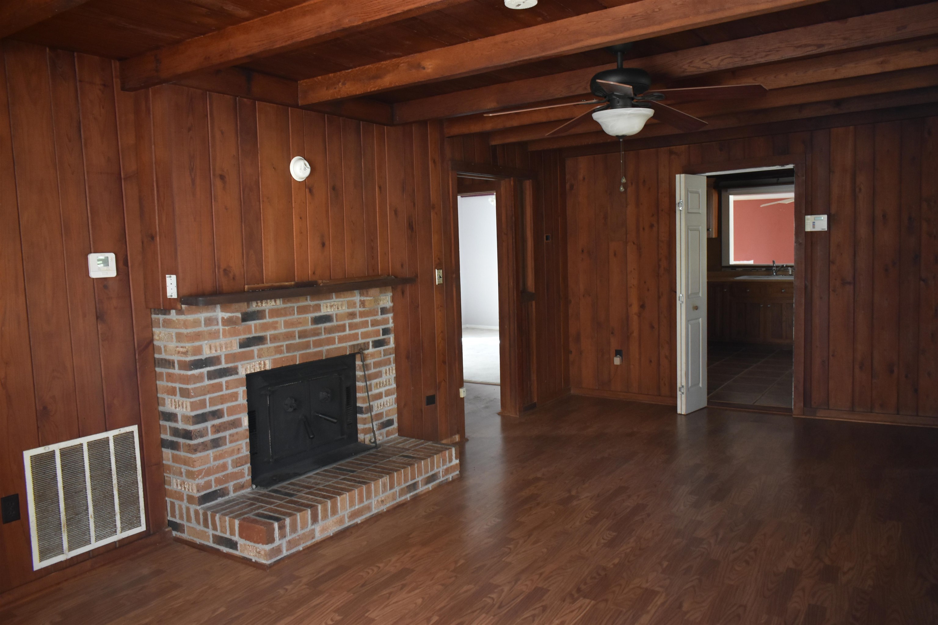 115 Falcon Street Selmer, TN 38375 - Photo 7 of 29 a view of fireplace with wooden floor
