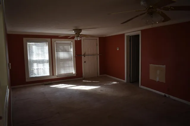a view of empty room with windows