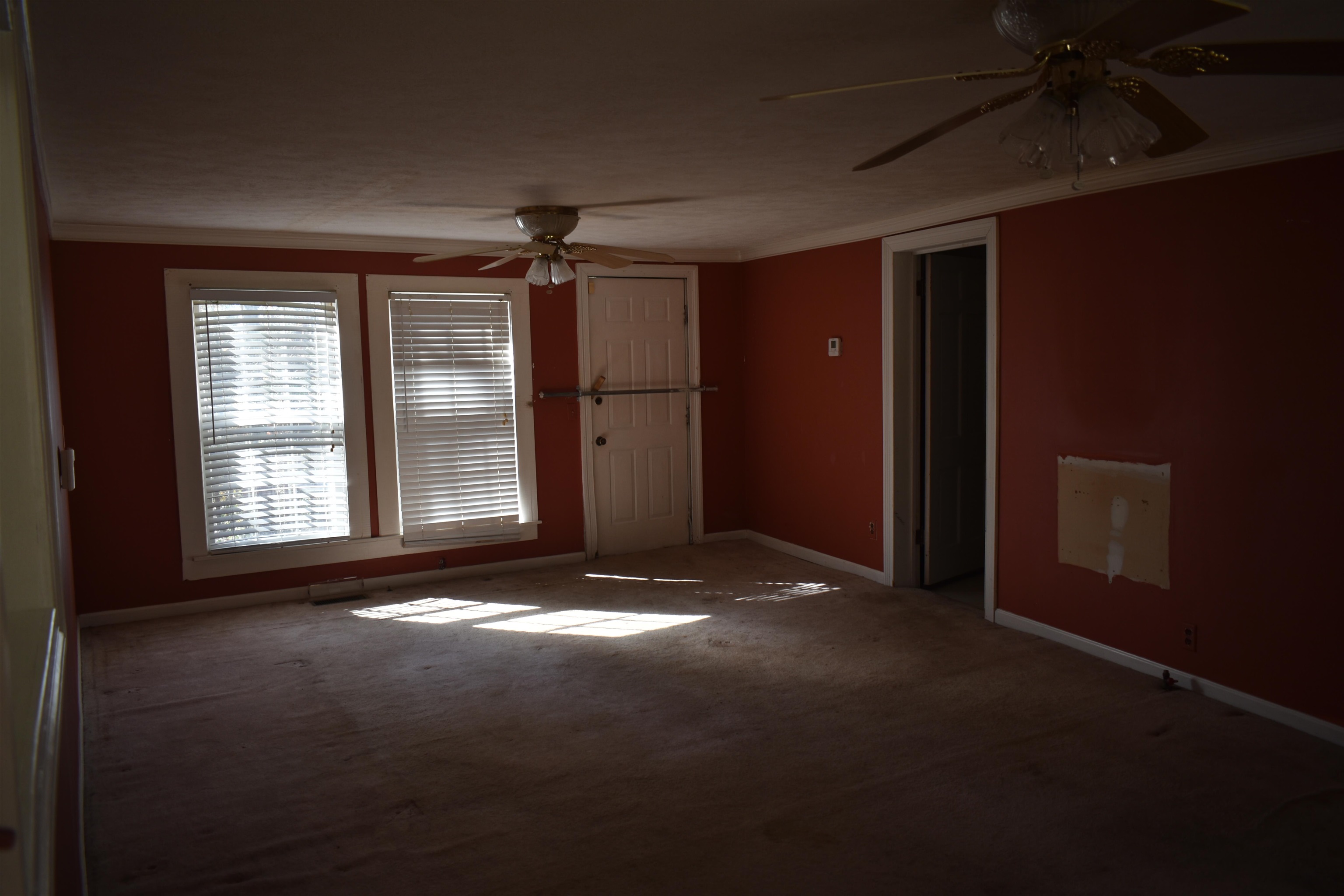115 Falcon Street Selmer, TN 38375 - Photo 8 of 29 a view of empty room with windows