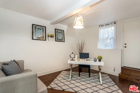 a work room with furniture and a window