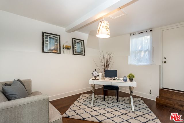a work room with furniture and a window