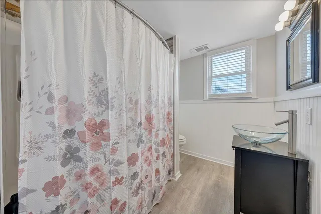 a bathroom with a sink and mirror