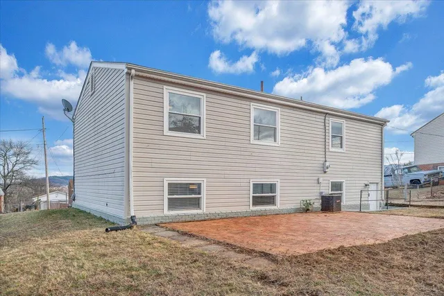 a view of a house with a yard and garage