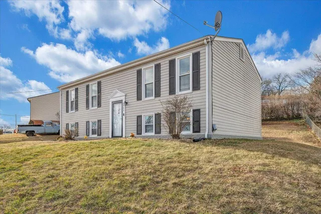 a view of a house with a yard