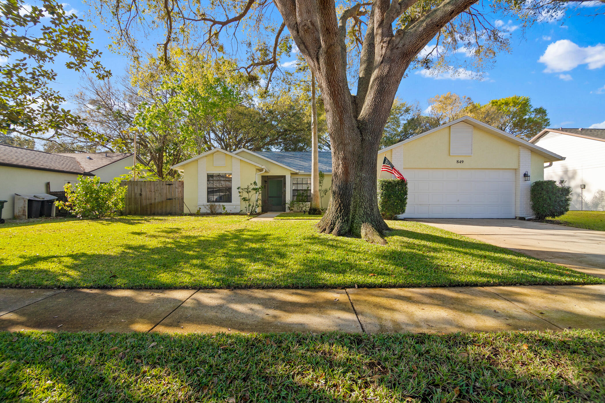 849 Gardener Road Rockledge, FL 32955 - Photo 1 of 31 a front view of a house with garden