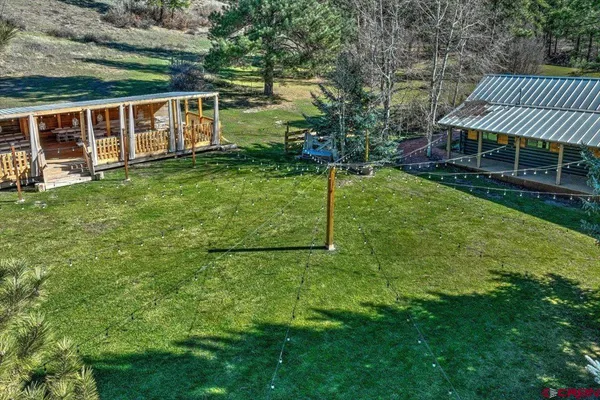 a view of a backyard of the house