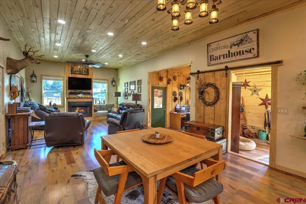 a kitchen with a stove a refrigerator and a fireplace