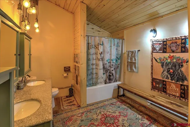 a bedroom with furniture and large window