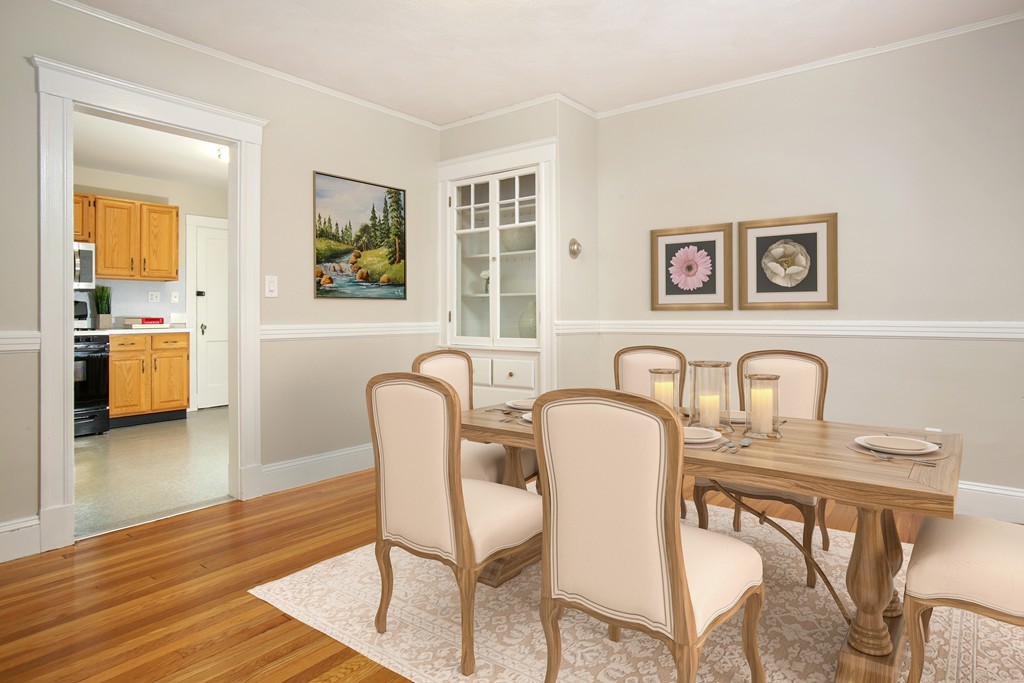 517 Heath Street Brookline, MA 02467 - Photo 4 of 12 a view of a dining room that has a table and chairs in it