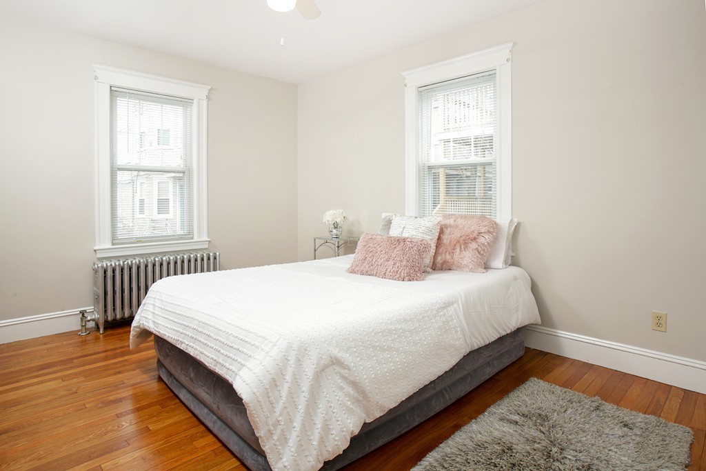 517 Heath Street Brookline, MA 02467 - Photo 6 of 12 a bedroom with bed and window