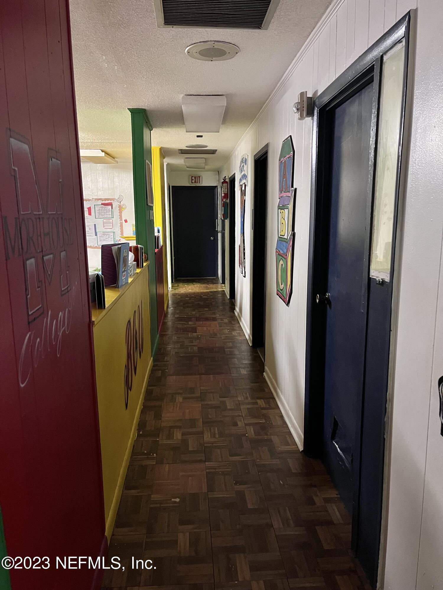 10367 Monaco Drive Jacksonville, FL 32218 - Photo 26 of 49 a view of a hallway with wooden shelves