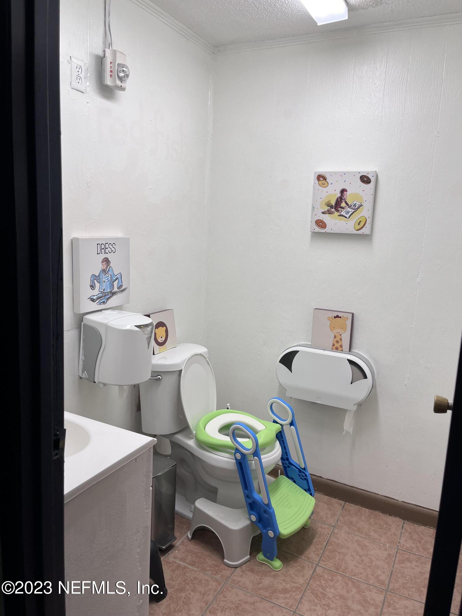 10367 Monaco Drive Jacksonville, FL 32218 - Photo 29 of 49 a white bath tub sitting next to a white toilet and a sink