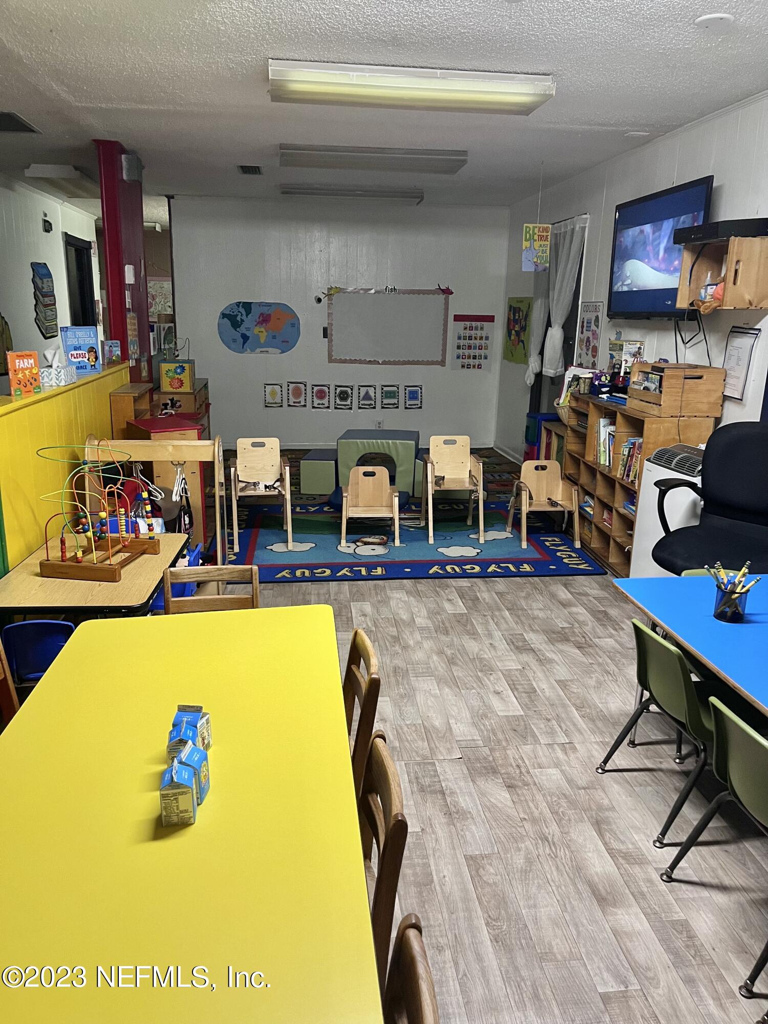 10367 Monaco Drive Jacksonville, FL 32218 - Photo 32 of 49 a living room with a table tennis pool table and a couch