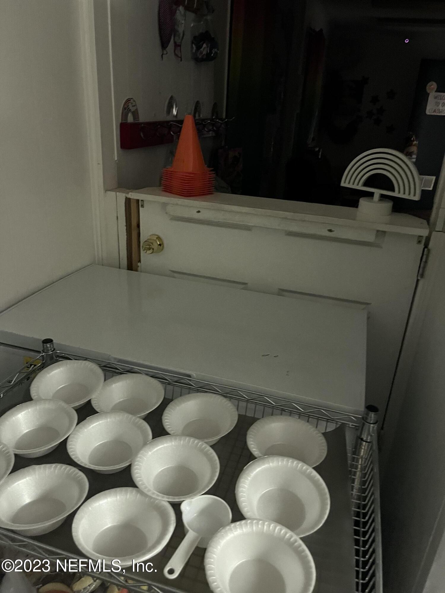 10367 Monaco Drive Jacksonville, FL 32218 - Photo 45 of 49 a bathroom with a toilet sink and mirror