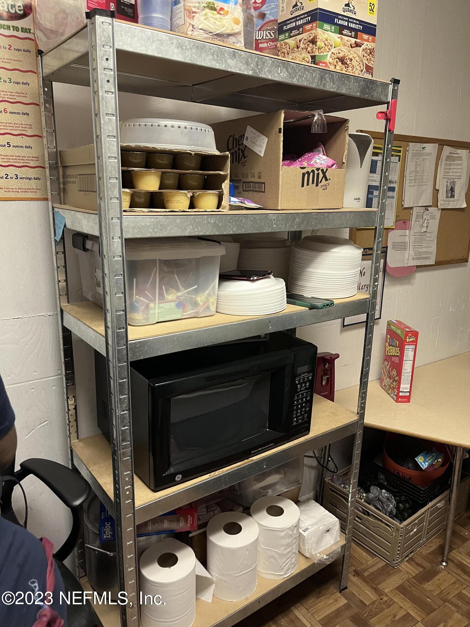 10367 Monaco Drive Jacksonville, FL 32218 - Photo 47 of 49 a kitchen with a stove and a microwave