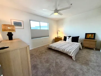 a bedroom with a bed and window